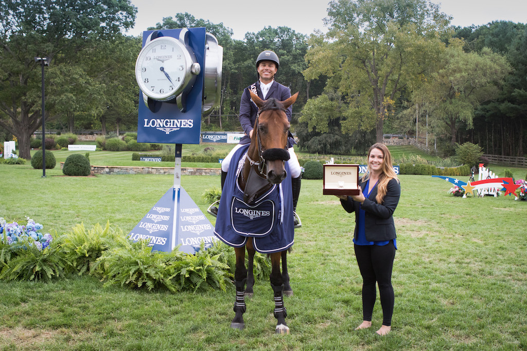 Kent Farrington was presented with a Longines watch by Kristina Hovelos, Events Manager from Longines. (Image: RedBayStock.com/FEI)