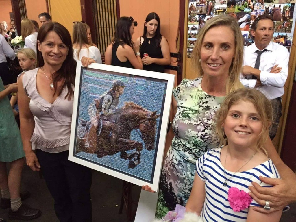 LIsa Purcell presents the finished mosaic to Olivia's mum and sister