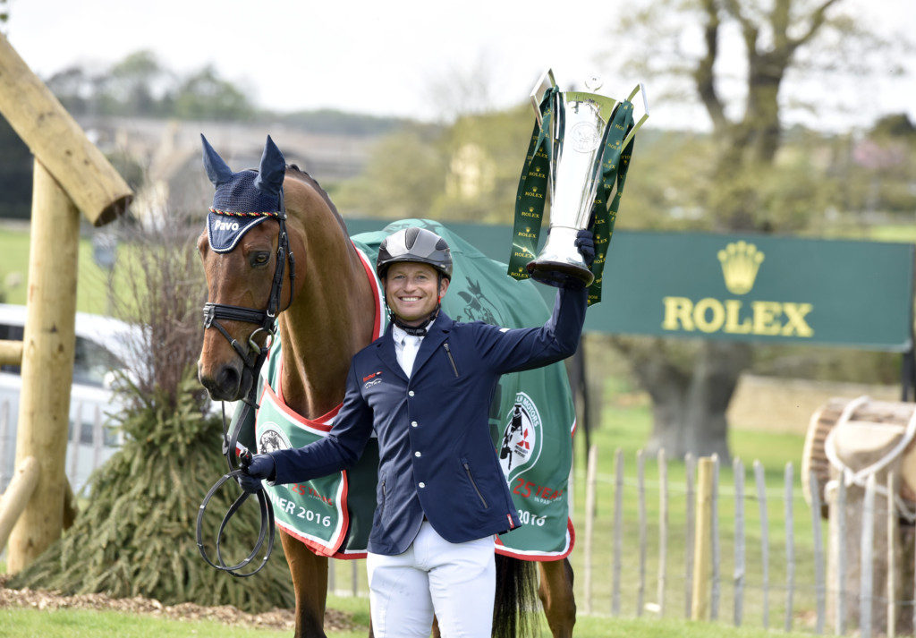 Michael Jung with Sam and his new trophy. Sam didn't enjoy the prize giving much, he notorious for playing up in this section! Photo Rolex / Kit Houghton