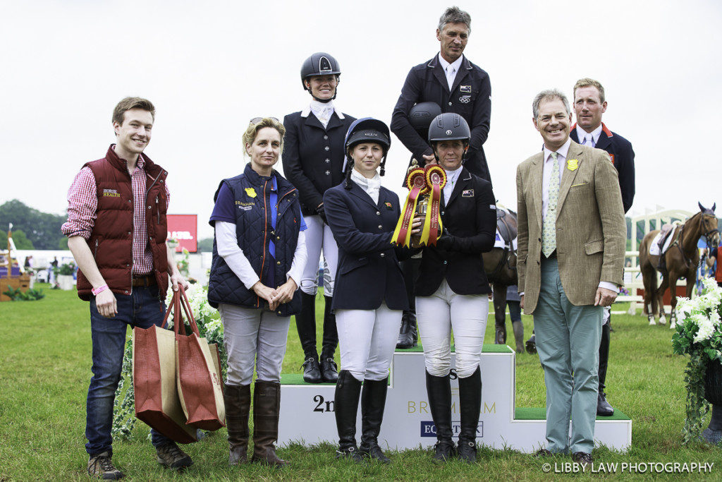 Caroline Powell and Emily Pragnall were the Pro-Am winners along with sponsors and Andrew Nicholson, Lauren Shannon and Oliver Townend on the podium. (Image: Libby Law)