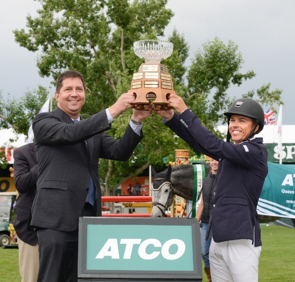 Kent Farrington with the QEII Cup, with sponsor Wayne Stensby (Image: Spruce Meadows Media Services)