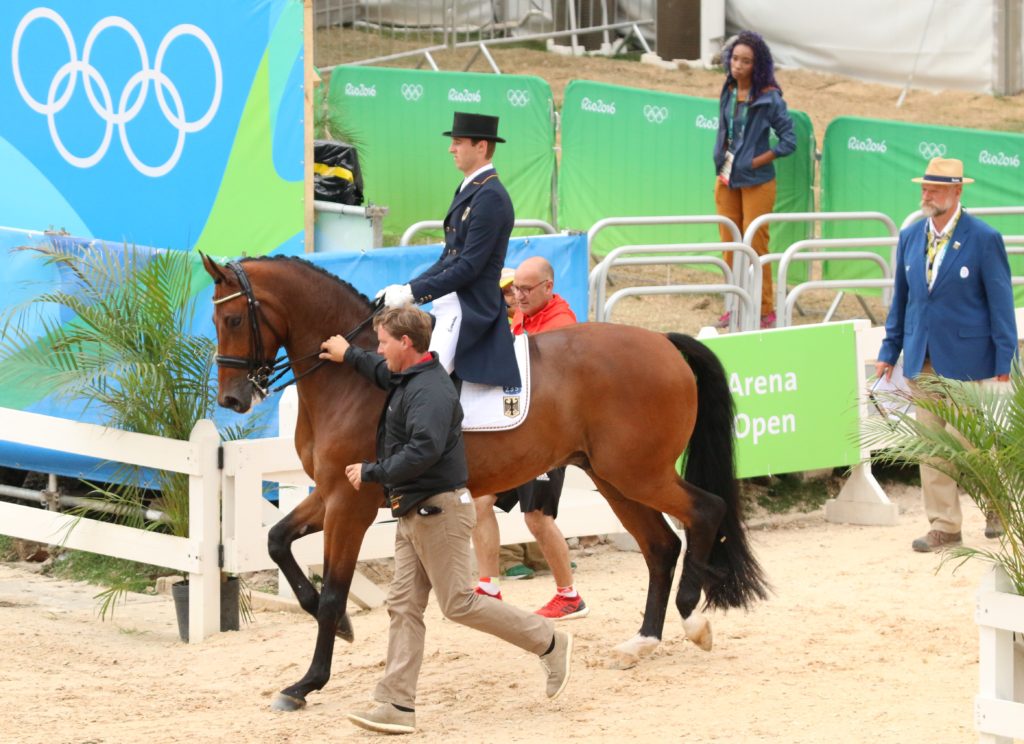 Sonke was led into the arena by his father Sven, which is possible under a recently-introduced rule. (Image: Jane Thompson) 