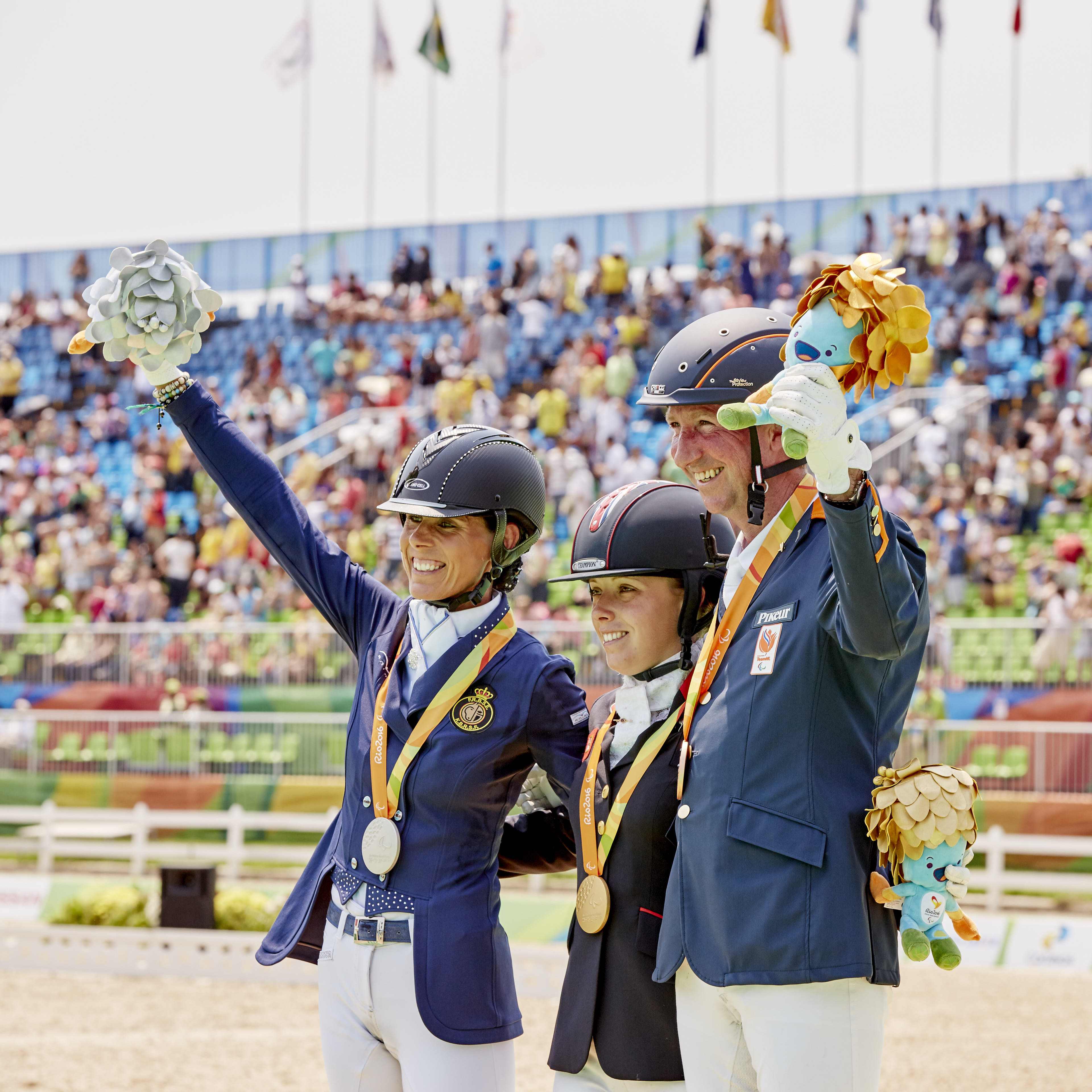 Grade IV Podium finish, Sophie Wells (Gold, UK), Belgium’s Michèle George (silver), and The Netherlands’ Frank Hosmar (bronze) (Image: FEI/Liz Gregg)