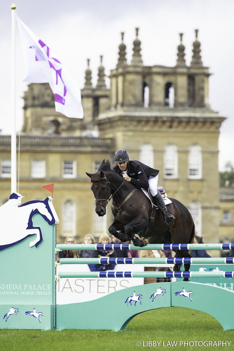 Jonathan Paget rides Angus Blue during the CIC3* 8 & 9 YO showjumping in front of Blenheim Palace (Image: Libby Law)