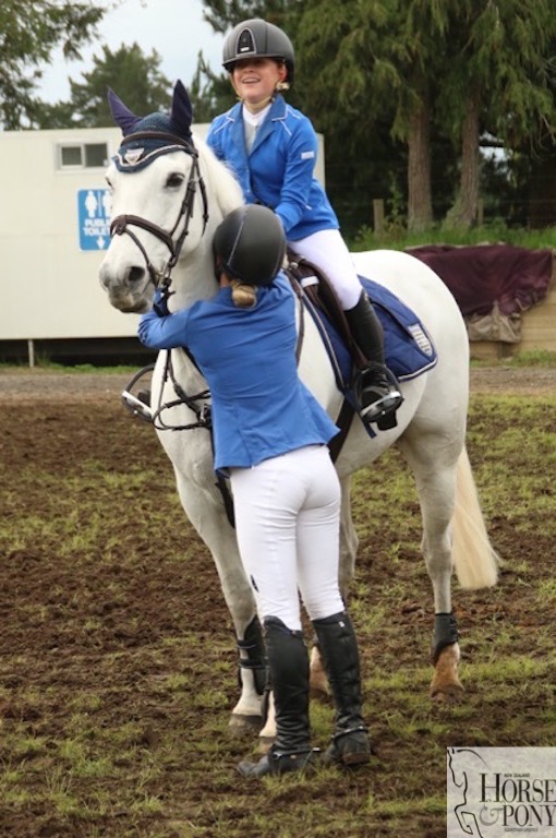 Hugs all round for Kabo Silver from the current rider, Isabella Du Plessis and the previous rider, Briar Burnett-Grant