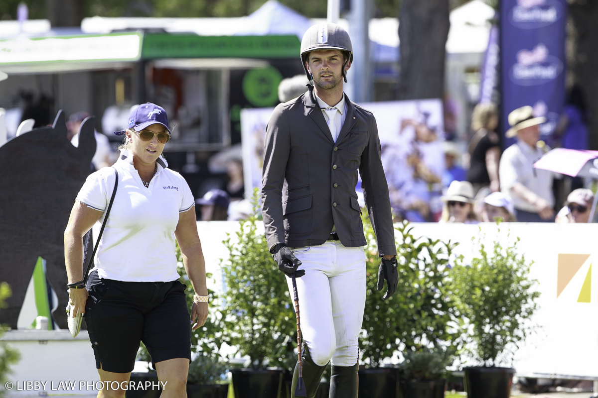 Katharine Van Tuyl and Andy Daines walking the show jumping course (Image: Libby Law Photography)